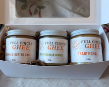 Load image into Gallery viewer, Three jars of Full Circle Ghee in a gift box on a white surface.
